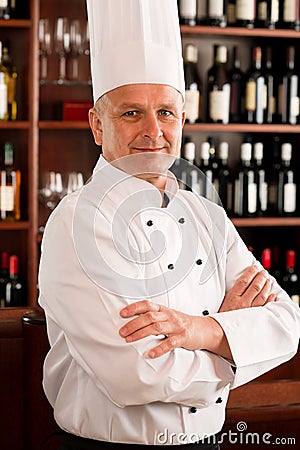 Chef cook confident professional posing restaurant