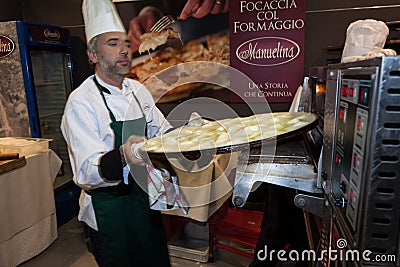 Chef cooking flat bread at Golosaria 2013 in Milan, Italy