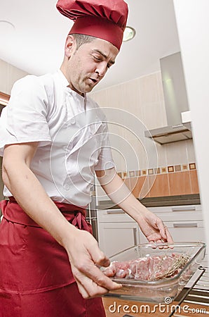 Chef in kitchen preparing food