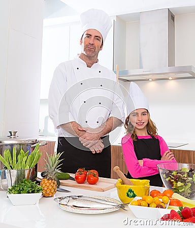 Chef master and junior pupil kid girl at cooking school