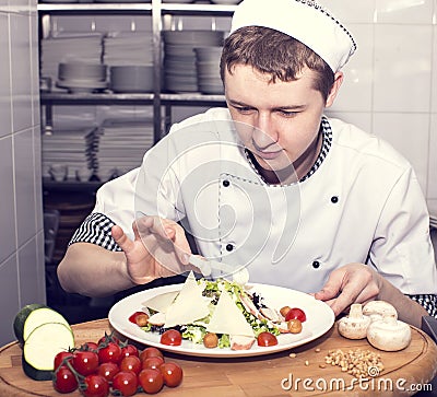 Chef prepares a meal