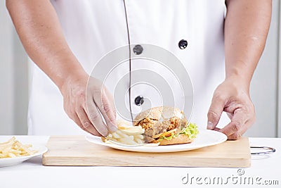 Chef preparing a burger