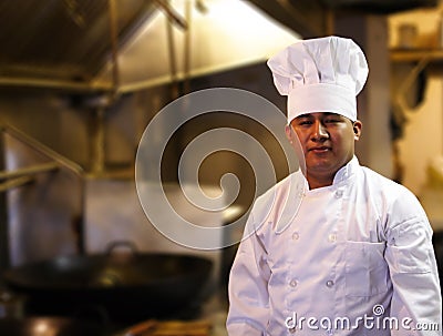 Chef Standing In Kitchen
