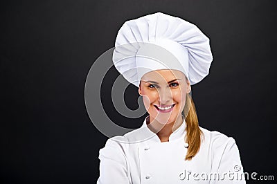 Chef woman over dark bacground standing