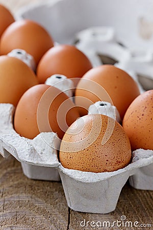 Chicken eggs on a wooden rustic table