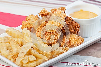 Chicken and fries with sour cream dip