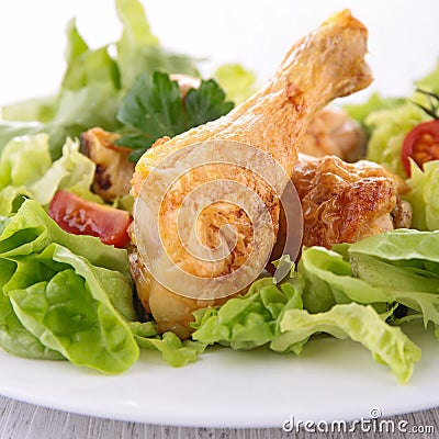 Chicken leg and salad
