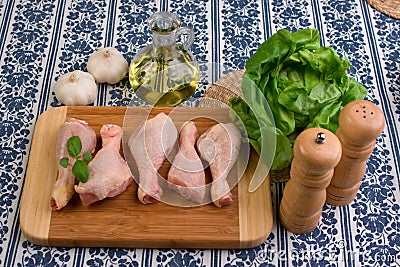 Chicken parts on wood board