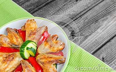 Chicken wings baked with vegetable