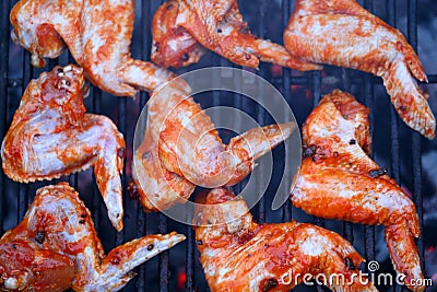 Chicken wings on smoking grill in the garden