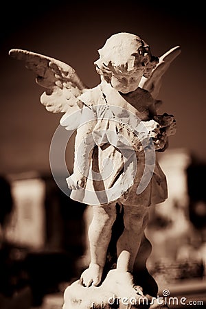 Child angel statue in a cemetery