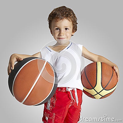 Child in basketball uniform and two balls