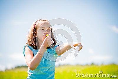 Child blowing whistle