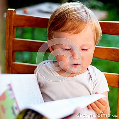 Child carefully reading