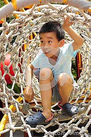 A child climbing a jungle gym.
