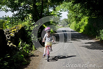 Child cycling a bike