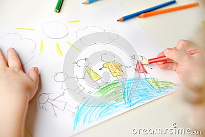 Child drawing children standing on globe