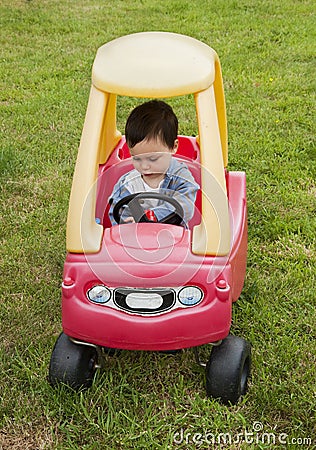 child-driving-toy-car-15304821.jpg