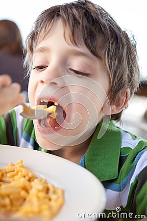 Child eating mac and cheese