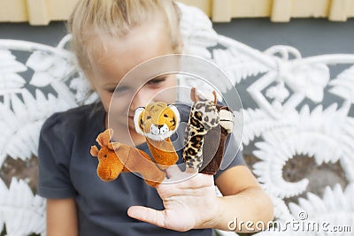 Child with finger puppets