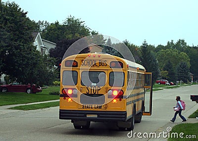 Child Getting on School Bus