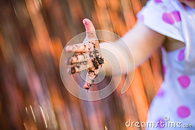 Child hand with dirt