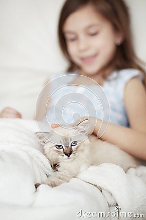 Child and kitten