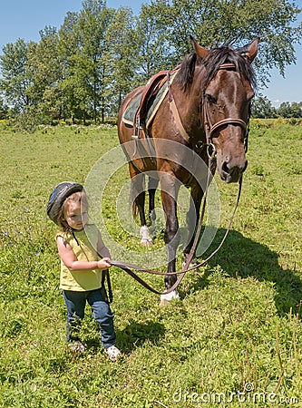 Child leading a horse