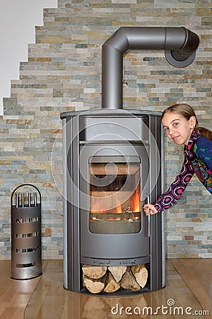 Child opening wood fired stove