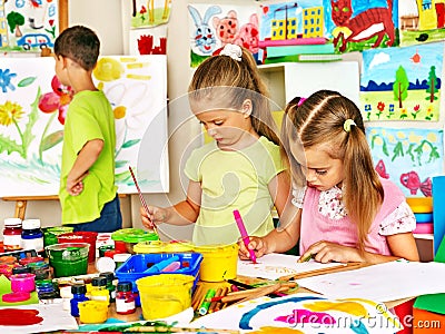 Child painting at easel.