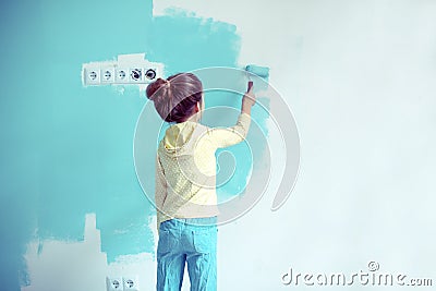 Child painting the wall