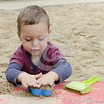 Boy Playing In Sandpit Stock Photography - Ima