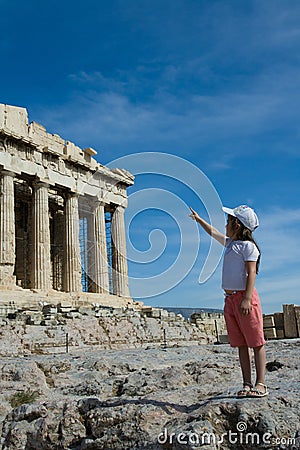 Child points to Ancient Parthenon Facade in Acrop