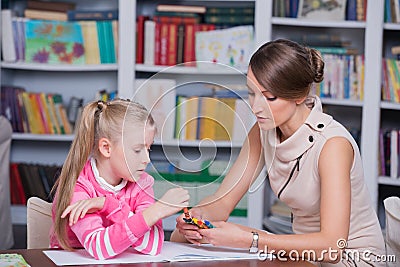Child psychologist with a little girl