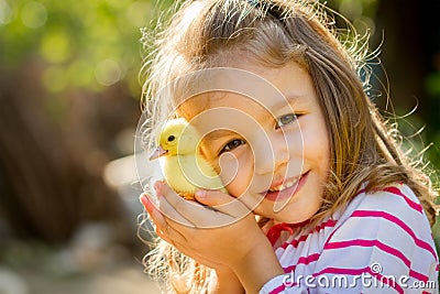Child with spring duckling