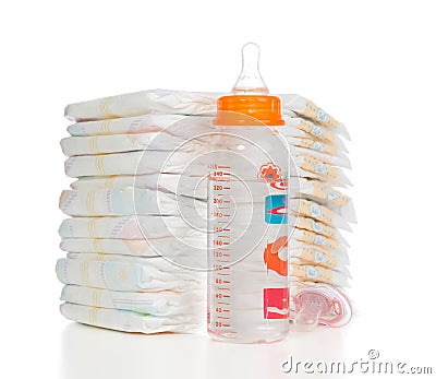 Child stack of diapers, nipple soother, baby feeding milk bottle