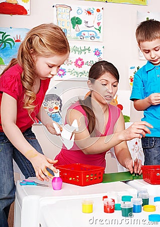 Child with teacher in play room.