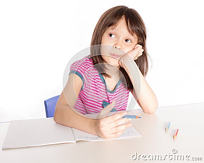 Child writing at desk