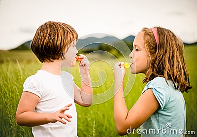 Children blowing whistle