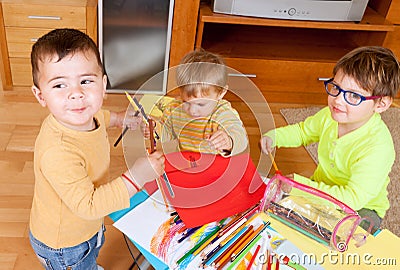 Children drawing with crayons