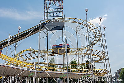 Children Having Fun In Roller Coaster