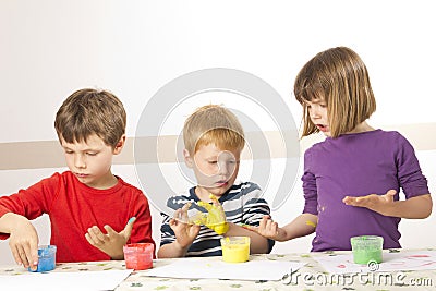 Children painting with finger paint