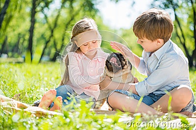 Children in park with pet