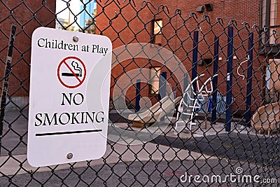 Children at play - no smoking as warning message, sign on metal,