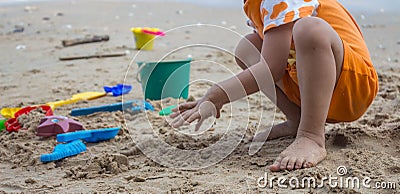 Children playing at the beach toys