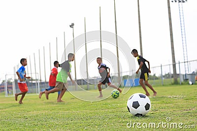 Children playing football on the field