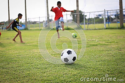 Children playing football on the field