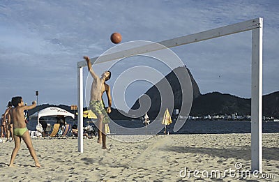 Children playing volley-ball on a beach in Rio de Janeiro, Brazi