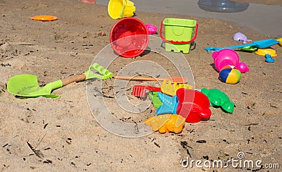 Children s plastic toys scattered on the beach