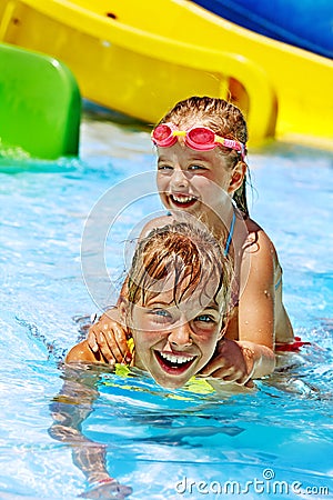 Children sitting on inflatable ring.